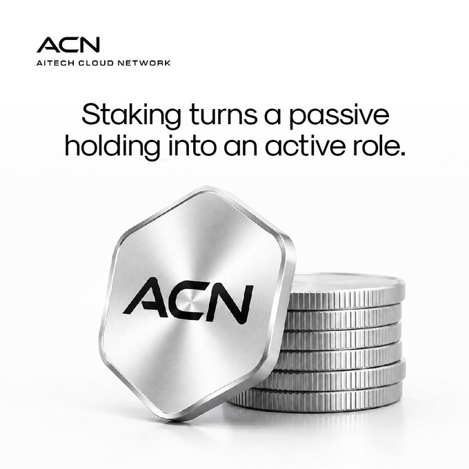 A promotional image for AITECH Cloud Network (ACN) featuring a hexagonal ACN token leaning against a stack of silver coins, with the tagline "Staking turns a passive holding into an active role." The visual reinforces the post's message by depicting the token as tangible, valuable assets, illustrating how staking transforms dormant holdings into productive contributions to the network.