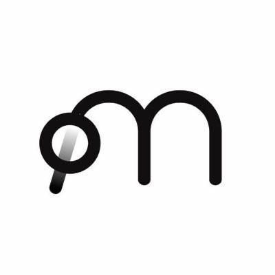 The image features a logo for a company named "Halfway into 2026" that has been created by @base. The logo consists of a stylized letter "M" rendered in black, with a magnifying glass positioned over it. The magnifying glass is depicted as a small circle and is slightly tilted to the right side. The background color of the image is white, which contrasts with the black elements of the logo. The company's name is written in black text below the logo, and there are additional details about the company's achievements and partnerships provided in the caption.