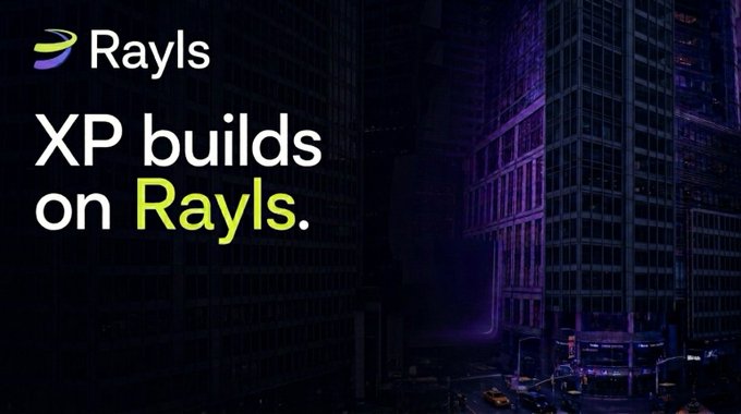 A dark, atmospheric promotional graphic for Rayls featuring a nighttime cityscape of skyscrapers with the tagline 'XP builds on Rayls.'