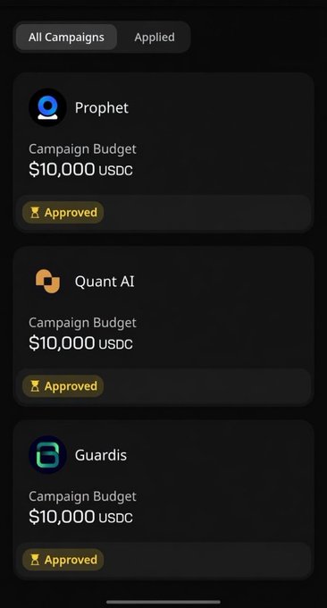 The image shows a smartphone screen displaying campaign budgets for different cryptocurrencies such as Prophet, Quant AI, and Guardis. The first line of the text in the bottom right corner reads "All campaigns approved!". The second line states that the budgets have been approved for three campaigns, with two campaigns approved on GM degens and another one on @wallchain. There is also a post indicating that a $10K budget has been approved by @useTria for Prophet & @KoloHub for Guardis.