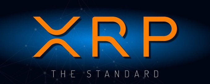 A digital graphic displays the orange 'XRP' logo with the tagline 'THE STANDARD' beneath it, set against a dark blue background with a network pattern.