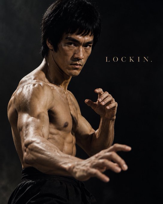A shirtless, muscular man (resembling Bruce Lee) poses in a fighting stance against a dark background, with the word 'LOCKIN.' displayed in white text.