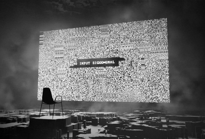 Black-and-white surreal digital artwork of a lone chair facing a large screen displaying TV static with the text 'NO INPUT SIGNAL', set in a dark, smoky landscape.