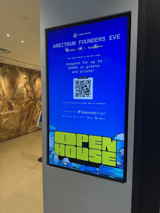 A digital display at the Arbitrum Founders Event in Singapore (October 7th) advertises an "Open House" promotion, offering up to $300k in grants and prizes, featuring a QR code and branding from Robinhood Chain as a sponsor. The sign aligns perfectly with the post's casual mention of sneaking into the Open House event.