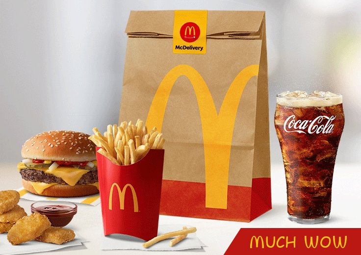 The image features a McDonald's menu with various food items, including a burger, fries, and a drink. The food items are displayed on a table, along with a brown paper bag that has a McDonald's logo on it. A Coca Cola soda can is also present in the scene. The post includes an enticing message about the "McDonalds accepts Dogecoin" and encourages viewers to eat at McDonald's for a free happy meal if they accept Dogecoin as payment.