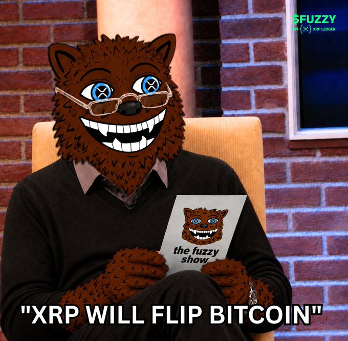 A person in a brown furry mascot costume with glasses sits in a chair against a brick wall holding 'the fuzzy show' card, with 'FUZZY XRP LEDGER' logo and text reading 'XRP WILL FLIP BITCOIN'.