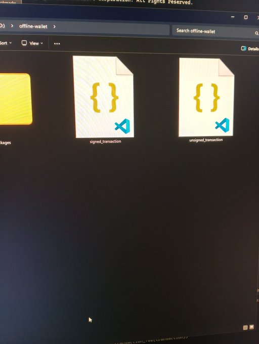 A photo of a Windows File Explorer window showing an "offline-wallet" folder containing "signed_transaction" and "unsigned_transaction" JSON files, illustrating the user's air-gapped Kaspa transaction process between an online Windows machine and an offline Linux laptop.