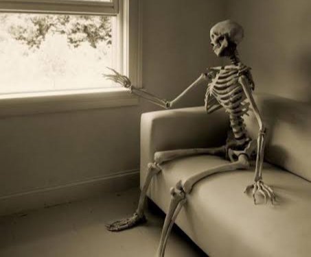 An AI-created image showing a skeleton sitting on a beige sofa next to a window, with one hand raised toward the glass.