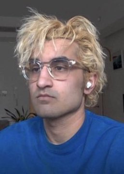 A blonde-haired young man wearing clear-framed glasses, wireless earbuds, and a blue shirt looks off-camera in what appears to be a video chat or livestream setup. The image likely shows FrankDeGods or an associate reacting to or commenting on the news that he closed his $PAID position for over $100K profit, coinciding with the token's market cap dropping from $12M to $8M.