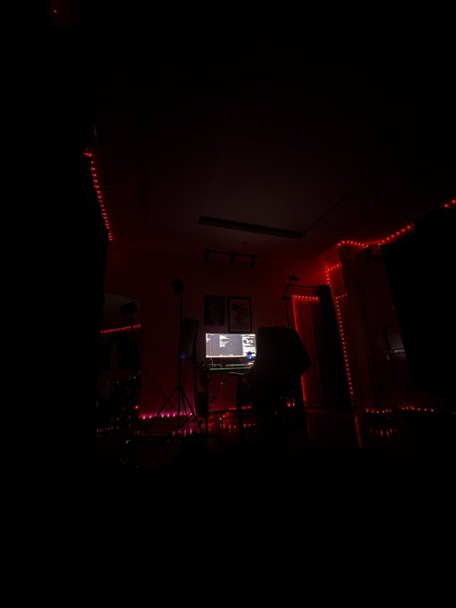 A dimly lit workspace illuminated by red string lights, with a glowing computer monitor as the main light source, captures a moody "good night" atmosphere.

The image aligns with the post "Gn" (good night) as the dark room with only the monitor and red lights glowing evokes a quiet, end-of-day vibe—a visual sign-off before sleeping.