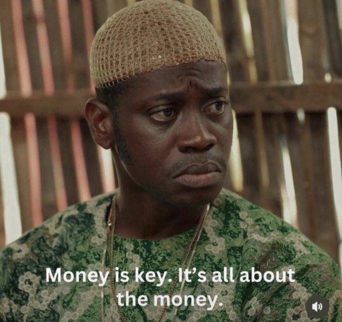 A man wearing a traditional woven cap and a green patterned shirt is shown in a scene with the subtitle 'Money is key. It's all about the money.'