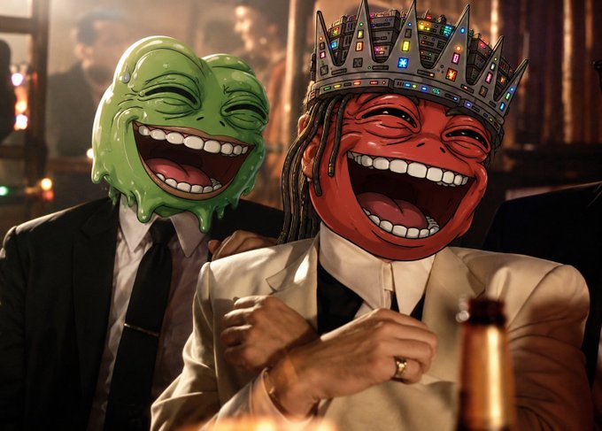 A humorous scene featuring two figures in suits wearing oversized, cartoonish smiling masks (one green, one red), with the red-masked figure wearing a crown decorated with colorful stickers, seated in a dimly lit bar setting.