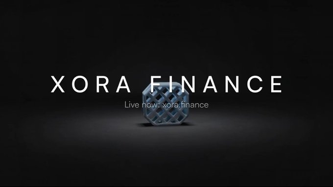 A dark promotional graphic with the text "XORA FINANCE" and "Live now: xora.finance" surrounding a geometric cube logo.