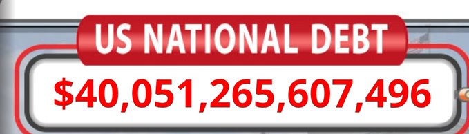 A red billboard graphic displays the text 'US NATIONAL DEBT' above the number '$40,051,265,607,496'.