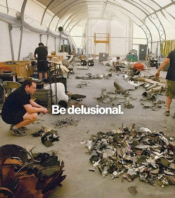 A photo inside a cluttered workshop tent shows people working among scattered debris and parts, with Elon Musk squatting on the left, overlaid with the text 'Be delusional.'