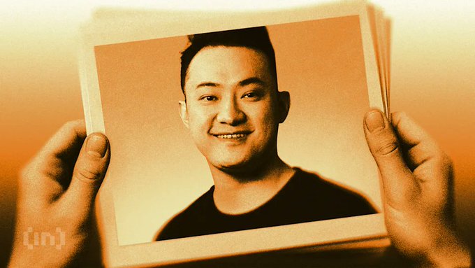 A pair of hands holds up a sepia-toned portrait photo of a smiling young man against an orange-tinted background. The image likely relates to the post's theme of uncovering hidden truths, with the "(in)" logo visible in the bottom left corner.