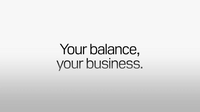 A minimalist Apple Card advertisement displays the text 'Your balance, your business.' on a white gradient background.