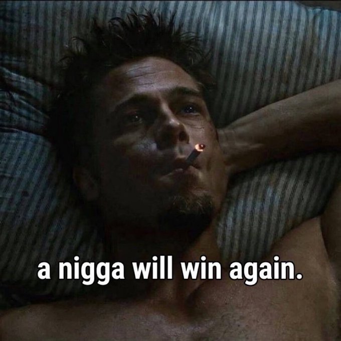 A shirtless Leonardo DiCaprio as Jordan Belfort in "The Wolf of Wall Street" lies back smoking a cigarette with a relaxed, confident expression. The caption "a nigga will win again" overlays the image, capturing a mood of triumphant swagger that aligns with the post's assertion "THIS IS GONNA BE ME."—both projecting bold self-assurance about future success.