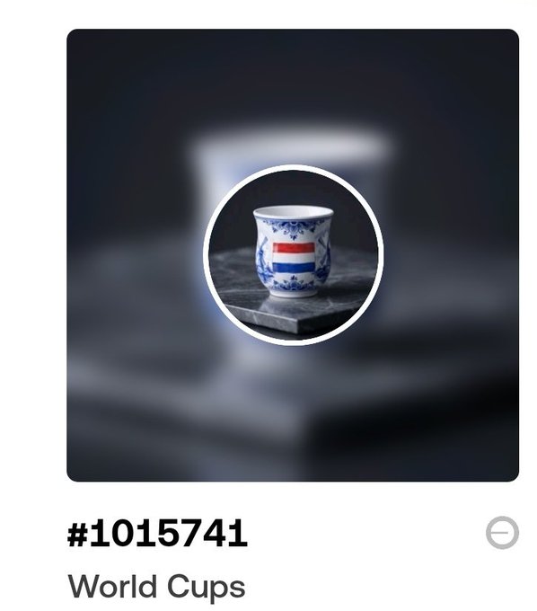 The image shows a small white cup with blue and red designs, placed on top of a stack of books. The caption for this image reads "I've just minted world cups #1015742 on base network how much $SEA / $BASE should I expect?". This suggests that the cup is being sold as part of a worldwide collection or series, possibly related to the World Cups event.