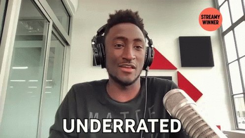 The image features a man wearing headphones while talking into a microphone at a radio station or podcast studio. The caption below the image reads "Underrated" which suggests that there might be an interesting topic related to computing, possibly about the decentralized side of computing networks like @quipnetwork.
