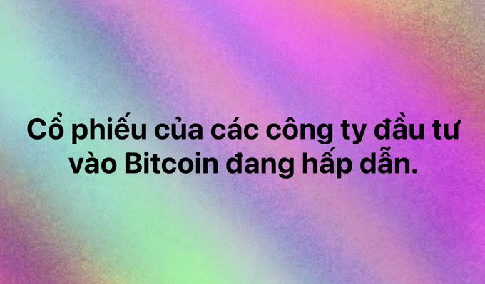 A Vietnamese text graphic with a colorful gradient background reading 'Cổ phiếu của các công ty đầu tư vào Bitcoin đang hấp dẫn' (Stocks of companies investing in Bitcoin are attractive).
