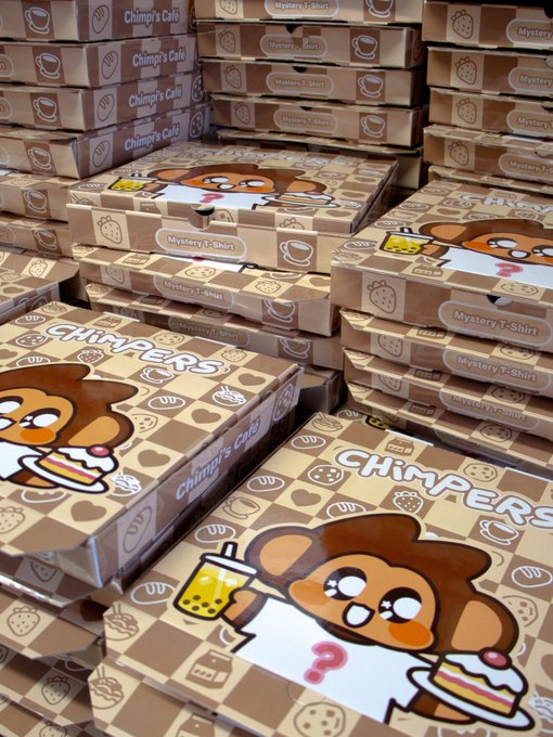 A large stack of cardboard boxes branded 'CHIMPERS' and 'Chimp's Café', featuring cartoon monkey illustrations and labels for 'Mystery T-Shirt'.