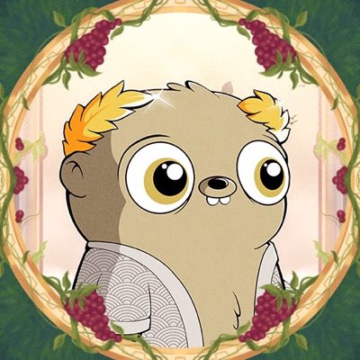 An illustrated character of a tan, furry creature with large eyes, wearing a patterned white garment, framed within a circular border decorated with red berries and green vines.