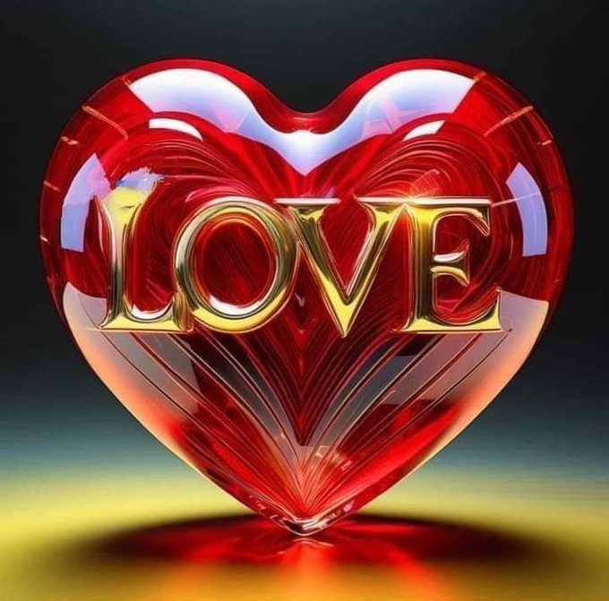 A glossy, 3D-rendered red heart-shaped gemstone with the word 'LOVE' inscribed in golden letters across its center.
