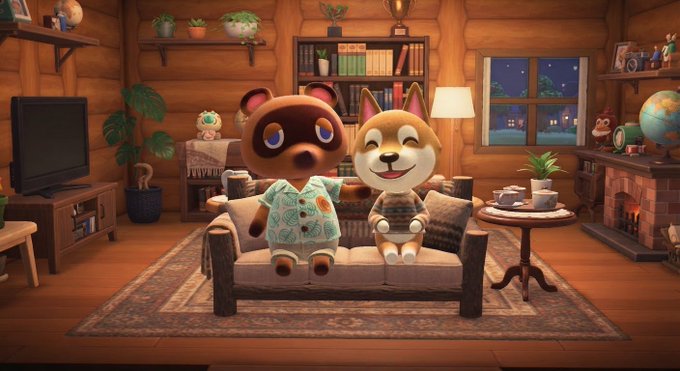 A cozy wooden cabin interior scene from Animal Crossing featuring Tom Nook and a Shiba Inu villager sitting together on a couch.