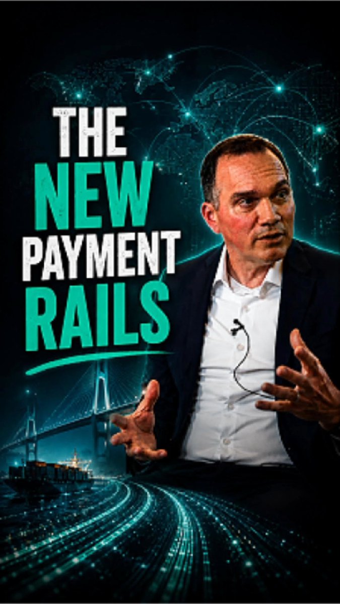The image features a man wearing a suit, sitting at a desk with his hands outstretched as if he's giving a speech or presentation. The background of the image shows a city skyline with train tracks running through it, suggesting that this scene takes place in an urban setting. The caption below the image reads "Stablecoins Are Becoming Global Payment Rails @XDCNetwork" and "Focus on what is in the image and how it relates to the post."