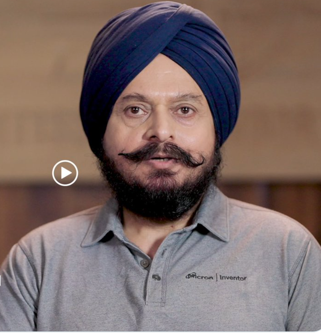 The image features a man wearing a grey shirt with a blue turban, which suggests that he might be from an Indian background or has a cultural connection to India. The caption "$MU Micron Vice President How' s your physiognomy?" is likely a reference to a popular facial recognition app called "Faces" developed by Microsoft. This app uses the unique facial features of individuals as a way to identify them, and it's often used for security purposes or in social media platforms.

The post seems to be promoting the app, which could potentially be related to the man's cultural background or personal experiences with the app. The caption is meant to spark curiosity about the man's facial features and possibly draw attention to the app.
