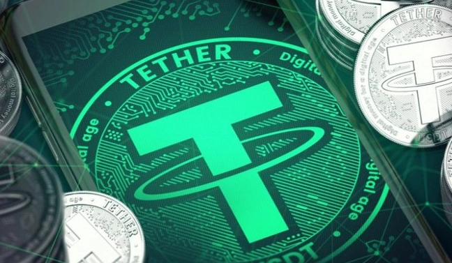 Close-up image showing Tether (USDT) cryptocurrency tokens and branding, featuring the green T logo with surrounding physical coins.