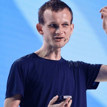 Vitalik Buterin, co-founder of Ethereum, is shown mid-speech on stage, likely presenting his 2030 vision for the blockchain to include faster block times, improved finality, lighter node requirements, and built-in zero-knowledge features.