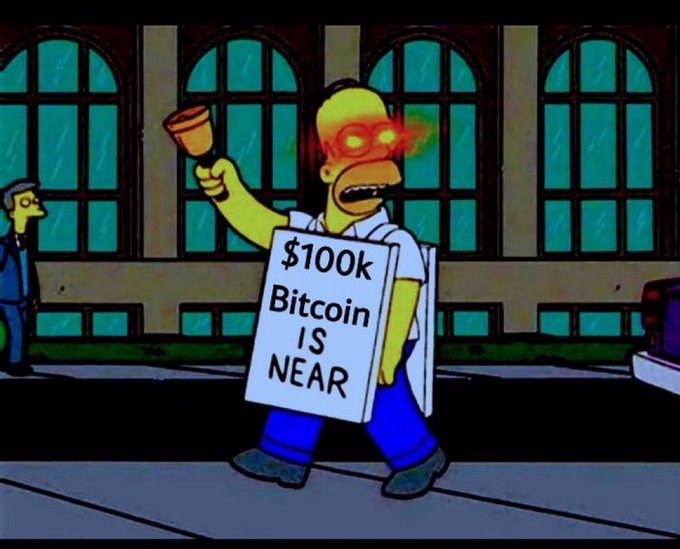 A cartoon-style parody image of Homer Simpson from The Simpsons, depicted with glowing red eyes, holding a 'doomsday' sign reading '$100k Bitcoin IS NEAR' on a city street.