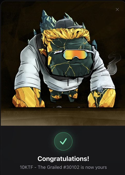 A success screen from the NFT marketplace showing "Congratulations! 10KTF - The Grailed #30102 is now yours" beneath an illustration of a gold-and-teal rock-like Golem character wearing sunglasses, a backwards cap, and a white hoodie—matching the post about purchasing the Grailed Luster Golem NFT.