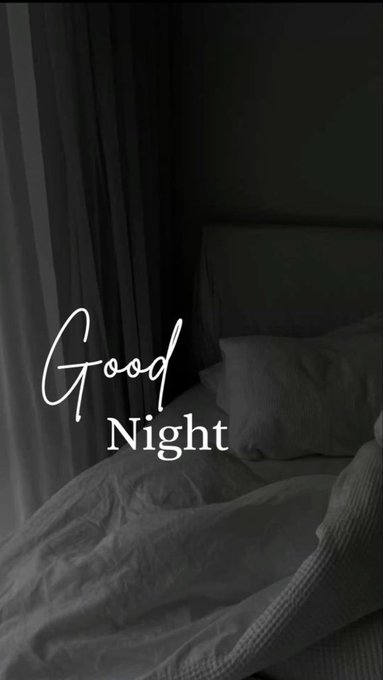 A dimly lit bedroom scene with rumpled white bedding and the words 'Good Night' written in white script across the image.