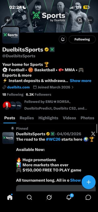 A screenshot of the @DuelbitsSports Twitter profile on X, showing 6.3K followers, a pinned post about #WC26 promotions, and the user begging to win the giveaway using the code "BakyXRTtW2cdivHrqoENQhSfaMjGLRgDudV8QSBGcKNf." The accompanying text expresses frustration about being a daily supporter without recognition, hoping to win despite the long odds.
