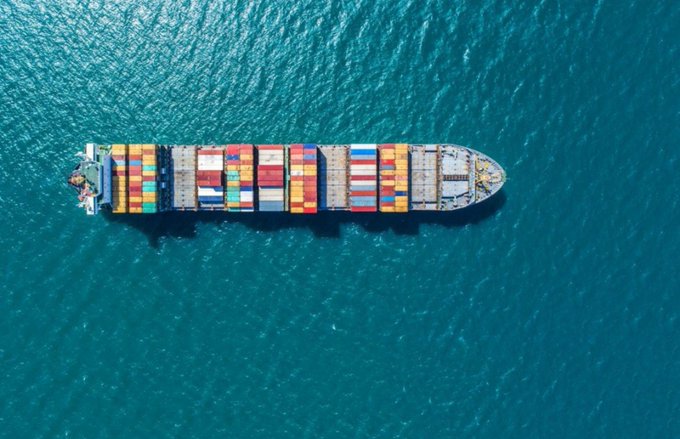 An aerial view shows a large cargo ship loaded with multi-colored shipping containers cruising through deep blue ocean waters, symbolizing the vast and complex maritime industry.

The image visually reinforces the post's message by illustrating the scale and complexity of global shipping—a sector generating massive amounts of data across various sources that EthraShip aims to organize into actionable intelligence, highlighting why maritime logistics is fundamentally a data challenge before it becomes a token opportunity.