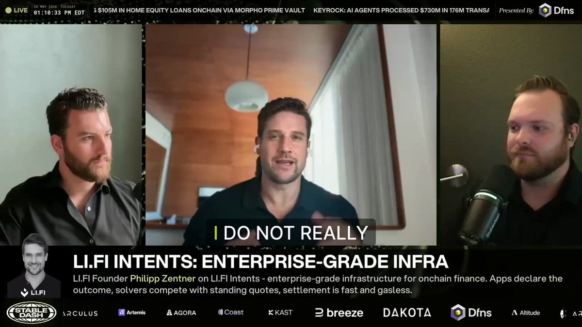 The image shows a screen with three men sitting behind microphones, appearing to be discussing or presenting information. The background of the image features a gray wall with a window. The text "Do not really" is displayed at the top of the image, while the words "Lifi Intents" and "@lifiprotocol" are also present in the scene.