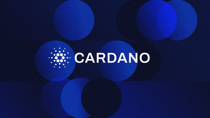 A graphic featuring the Cardano cryptocurrency logo and name in white text, set against a dark blue background with overlapping circular shapes in varying shades of blue.