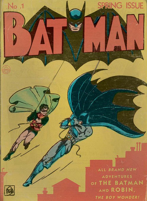 The image shows the iconic cover of "BATMAN" comic book, marked as "No. 1" and "SPRING ISSUE," featuring Batman swinging alongside Robin in their classic costumes against a city skyline, with text promoting "ALL BRAND NEW ADVENTURES OF THE BATMAN AND ROBIN, THE BOY WONDER!" This vintage comic relates to the post, which advertises a rare Batman comic (#527 of 741) sold for $98.51 in Solana to a buyer on the blockchain marketplace.