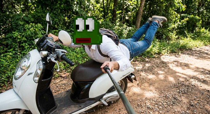 A photo of a person on a scooter taking a selfie with a selfie stick, their face covered by a green pixelated character face sticker, on a dirt path surrounded by greenery.