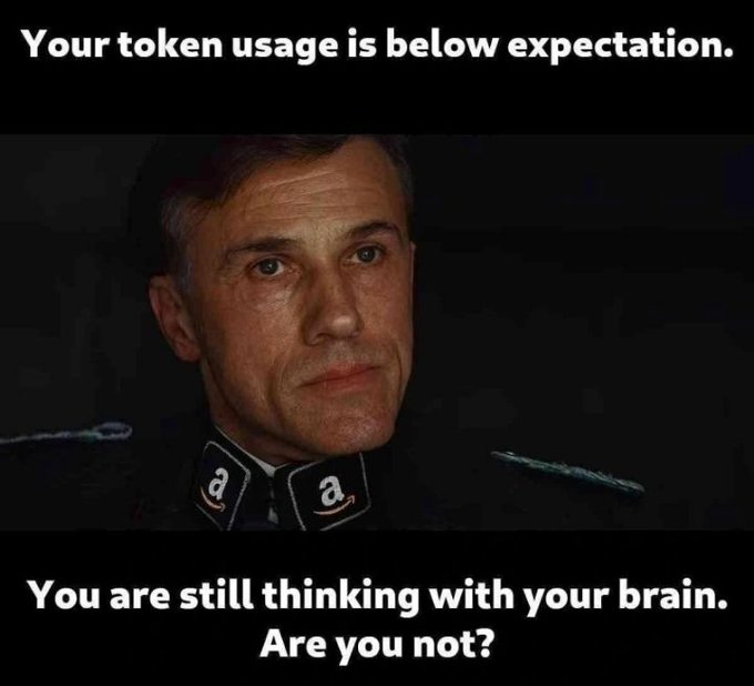 A meme featuring a close-up of Christoph Waltz in a dark uniform reads: 'Your token usage is below expectation. You are still thinking with your brain. Are you not?'