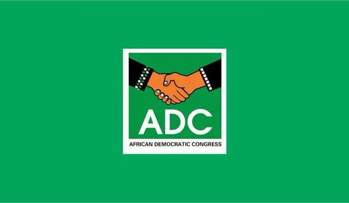 In the image, there are two hands shaking hands over a green background with the words "African Democratic Congress" written above them. The hands appear to be of different sizes, suggesting that they might belong to different individuals or could represent opposing political views. The overall scene conveys a sense of unity and cooperation between the two parties.