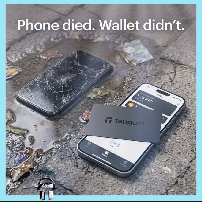An advertisement reads 'Phone died. Wallet didn't.' above a cracked, broken smartphone lying in a puddle next to a working phone displaying a Tangem hardware wallet with 1.25 BTC.