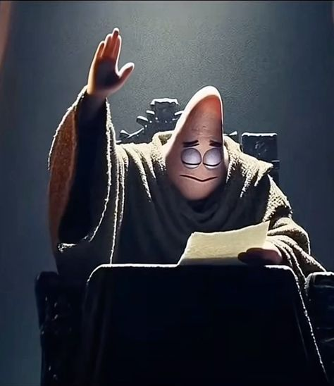 A 3D animated hooded figure with a tall pointed head sits behind a dark desk in dramatic lighting, raising one hand while holding a scroll.