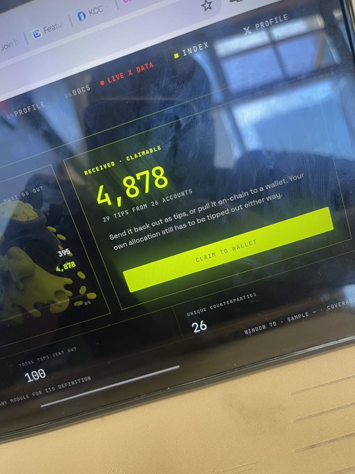 A close-up of a computer screen showing the Motion Tips dashboard with "4,878" claimable tips from 26 accounts, featuring a prominent yellow "CLAIM TO WALLET" button. The image illustrates the post's message, highlighting the user's accumulated $MOTION tokens that they're unable to withdraw despite having a significant balance ready to be claimed.