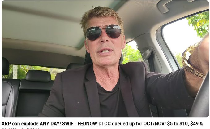 A man in sunglasses and a black blazer sits in the driver's seat of a car, speaking to the camera. The caption "XRP can explode ANY DAY! SWIFT FEDNOW DTCC queued up for OCT/NOV! $5 to $10, $49 &" appears below, teasing a video about XRP price predictions and financial system updates.
