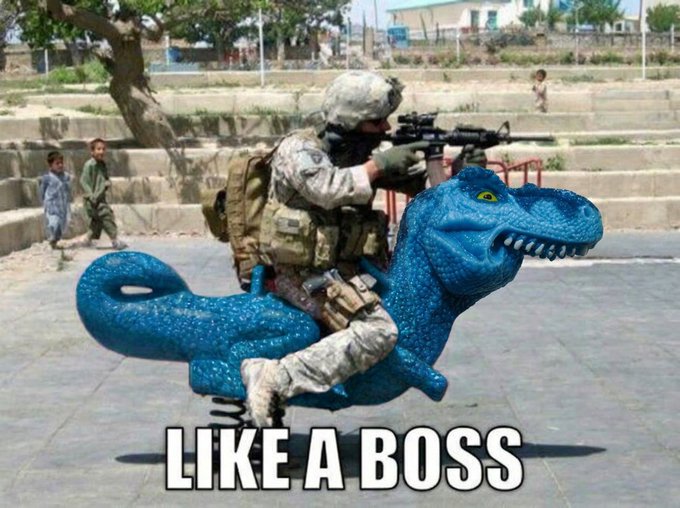 A soldier in full combat gear rides a blue dinosaur spring‑toy while aiming a rifle, with the bold caption “LIKE A BOSS” overlaid at the bottom.