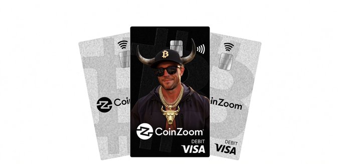 Promotional image of three CoinZoom debit Visa cards, with the center card featuring a man wearing a horned Bitcoin hat, sunglasses, and gold chains against a black background.
